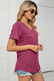 Heathered V-neck t-shirt in hot pink with short sleeves and a relaxed fit.