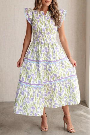Lavender tulip print midi dress with smocked waist, tiered skirt, and ruffled cap sleeves.