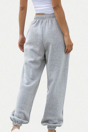 Light gray relaxed-fit sweatpants with elastic waistband and cuffed ankles.