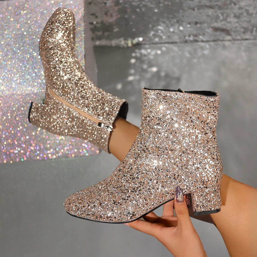 Gold sequin ankle boots with a side zipper and block heel.
