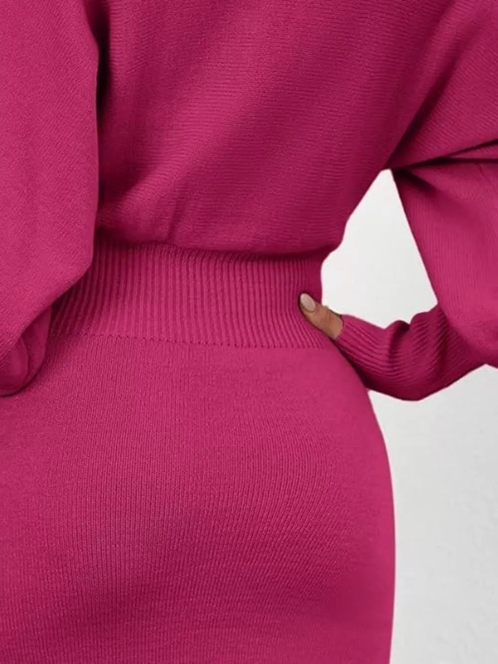 Rose red acrylic bodycon sweater dress with dramatic lantern sleeves and ribbed waist detail.