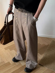 Mocha high-waisted wide leg pants with button detail and a belt.