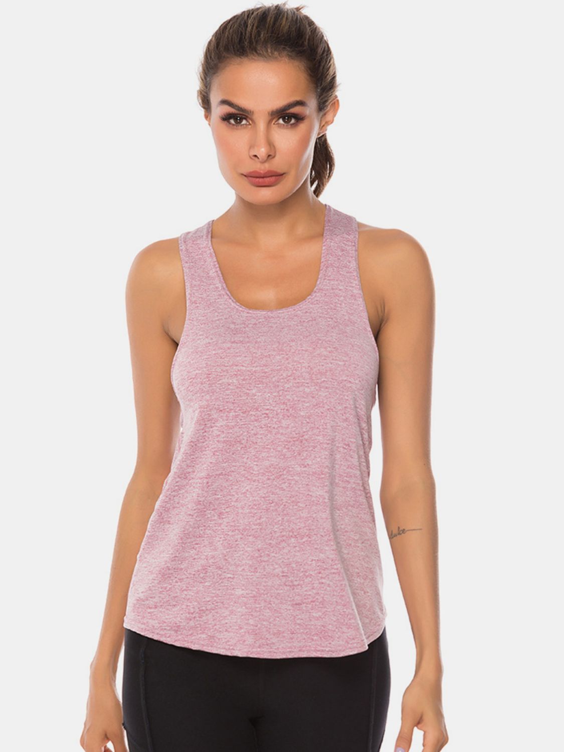 Racerback performance tank top in heathered blush pink with a scoop neck.