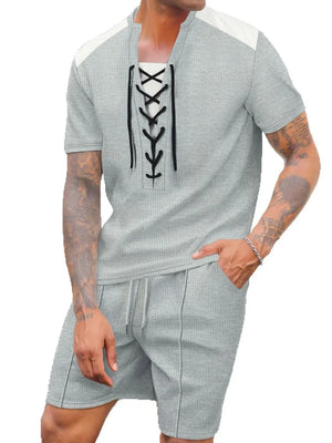 Gray waffle knit lounge set with lace-up neckline and drawstring shorts.