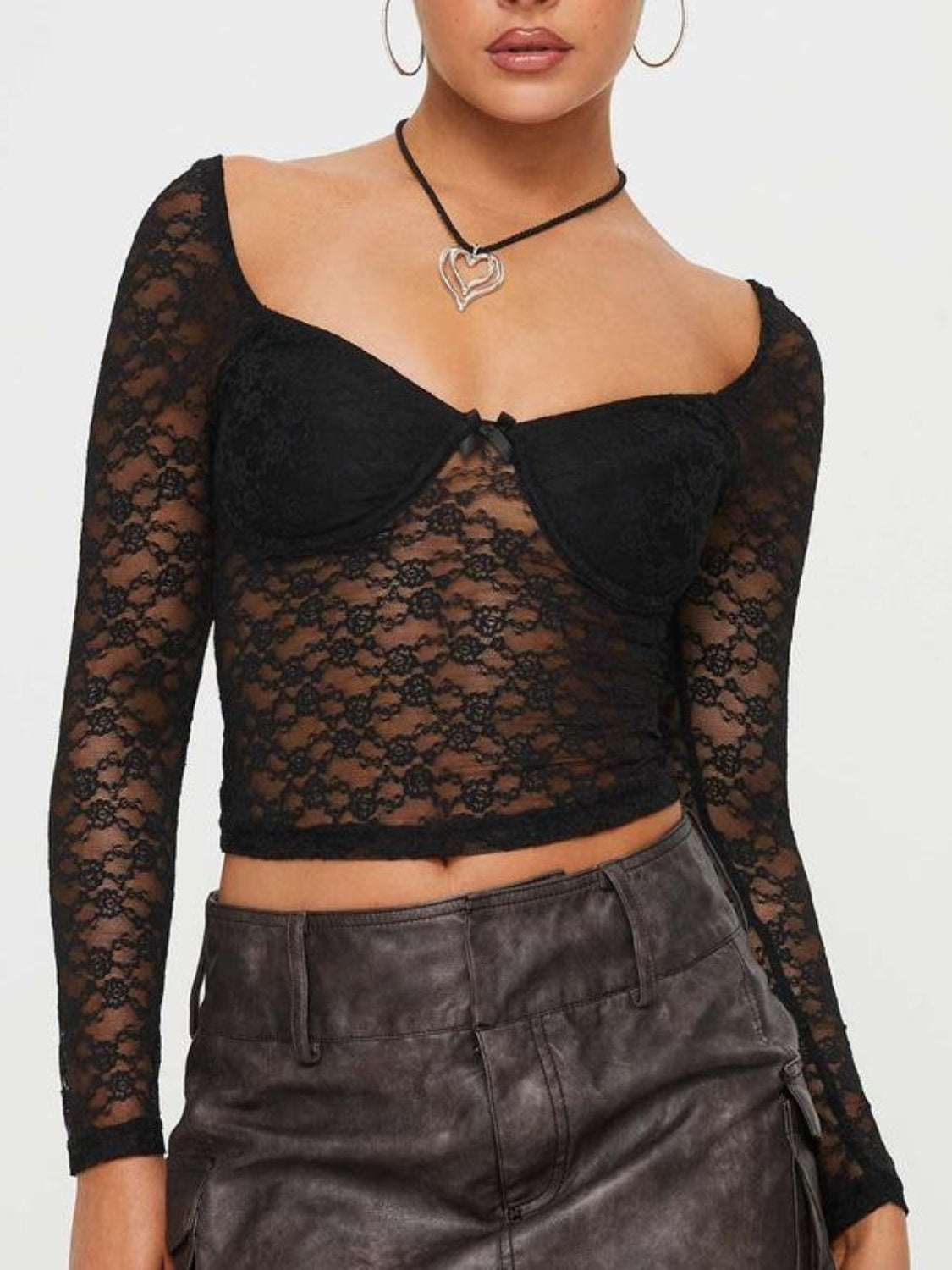 Black lace sweetheart bustier top with long sleeves and a bow detail.