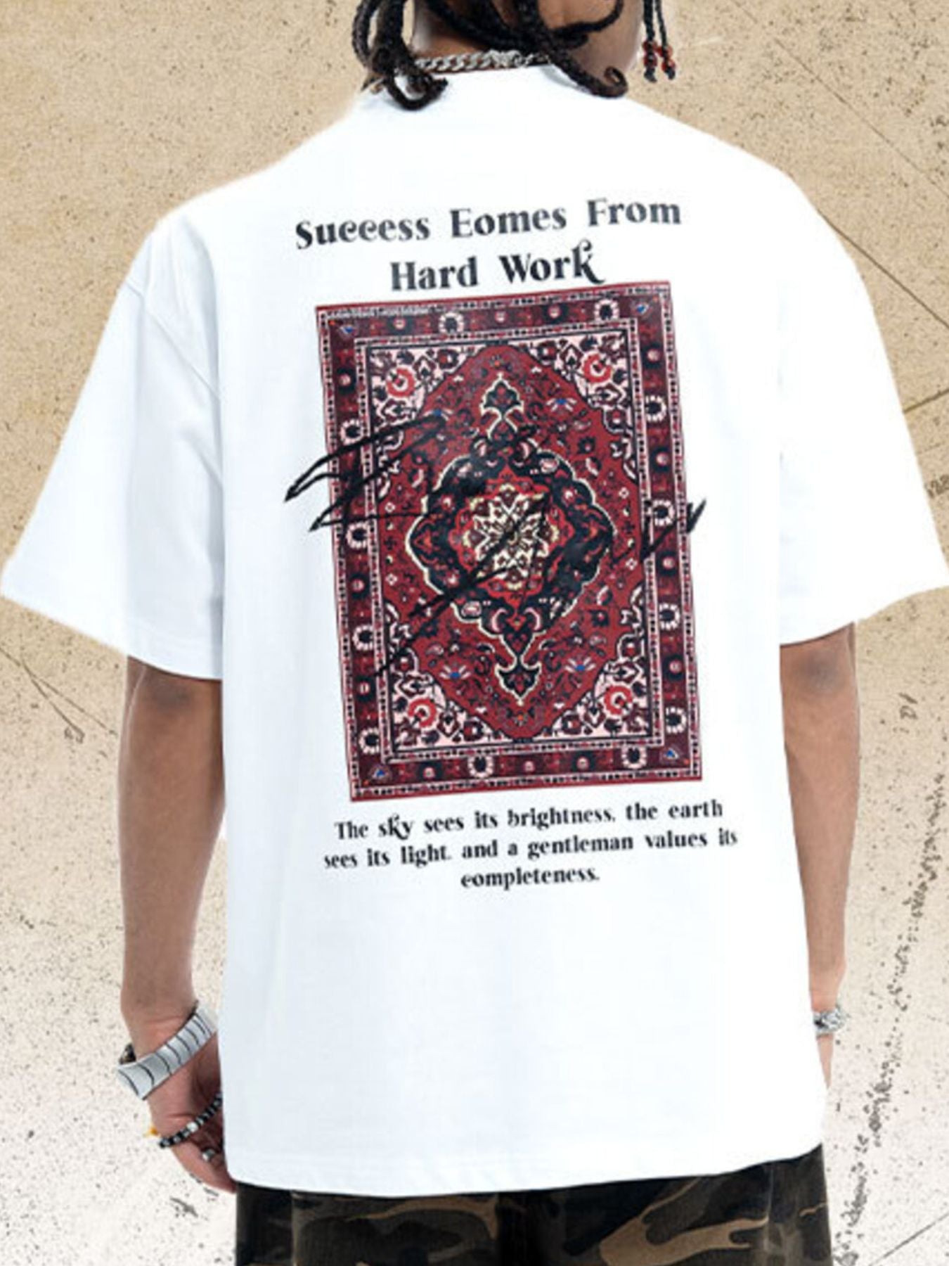 White cotton crew neck t-shirt with a bold graphic print of a Persian rug and text on the back.