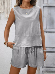 Black and white striped sleeveless top and drawstring shorts set with a round neckline.