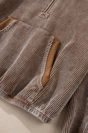 Brown corduroy pullover hoodie with quarter zip and pocket detail.