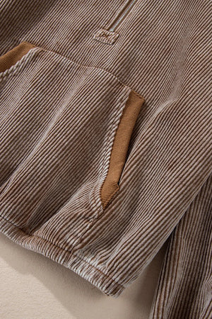 Brown corduroy pullover hoodie with quarter zip and pocket detail.