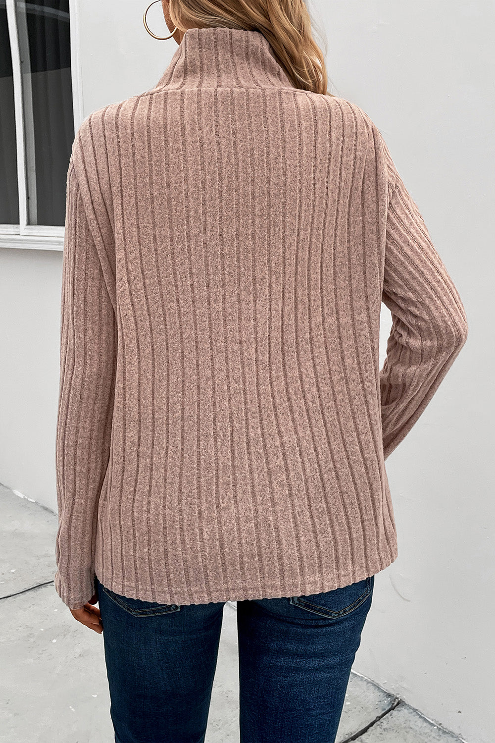 Mocha ribbed knit top with a high neckline and long sleeves.