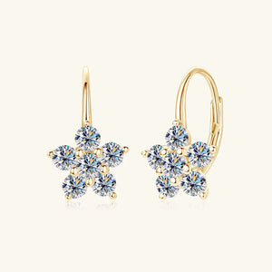 Gold celestial cluster huggie hoop earrings with clear cubic zirconia stones.