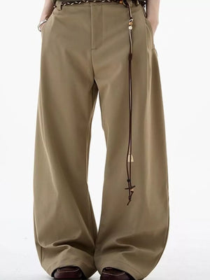 Men's relaxed fit wide-leg sweatpants in khaki with a decorative drawstring detail.