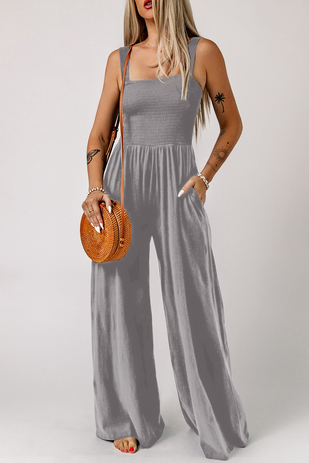 Sway Square Smocked Jumpsuit in grey with wide legs and pockets.