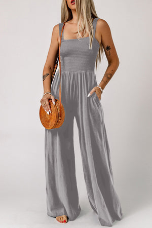 Sway Square Smocked Jumpsuit in grey with wide legs and pockets.