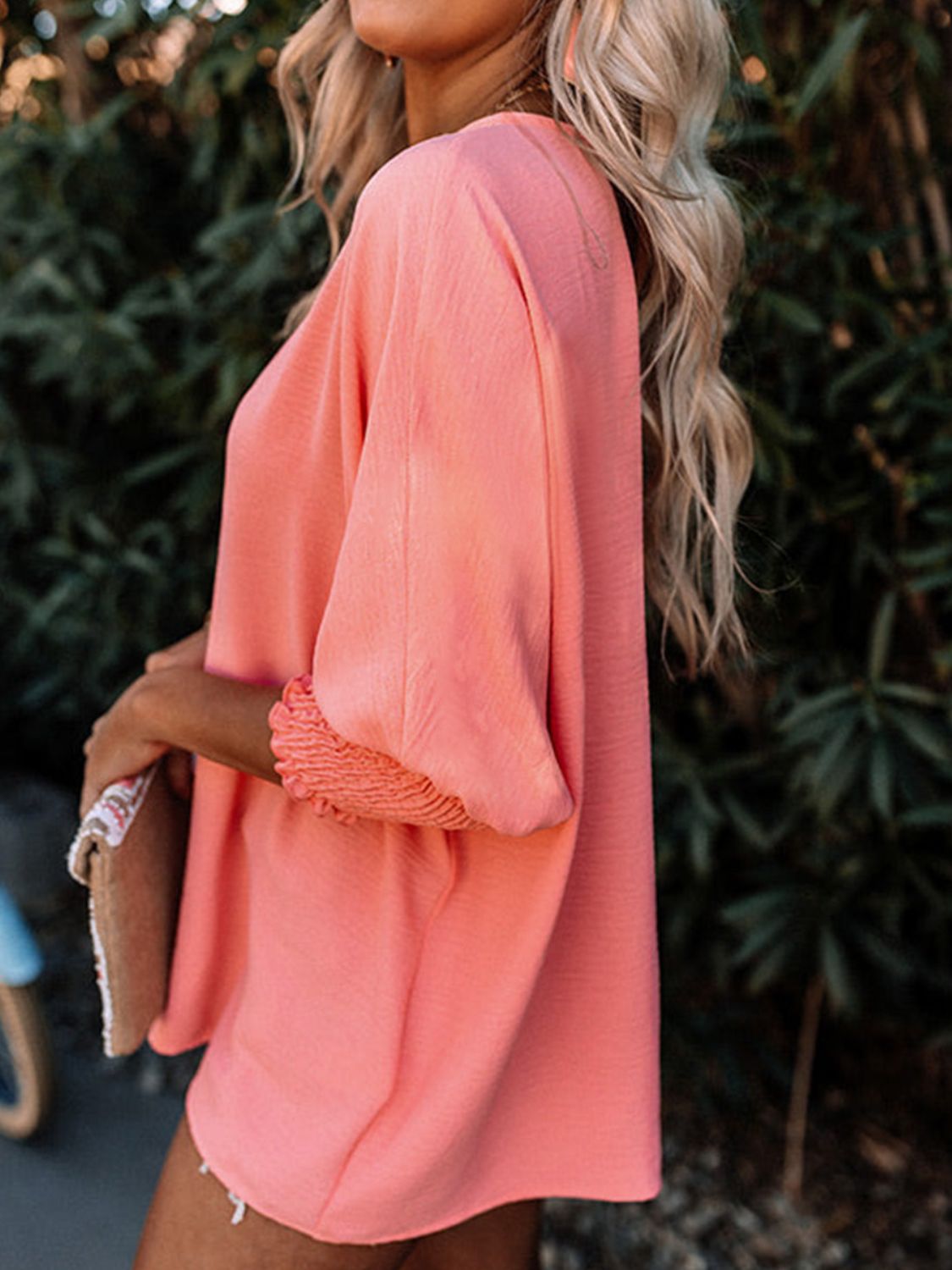 Burnt coral textured sleeve blouse with elastic cuffs and a relaxed fit.