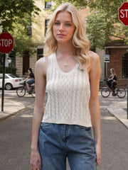 Beige cable knit tank top with V-neck and sleeveless design.