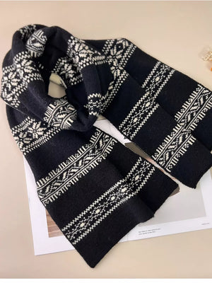 Black and white reversible snowflake wool blend scarf with fair isle pattern.