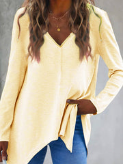 Light yellow ribbed knit tunic with V-neck and asymmetric hem