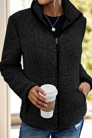 Black teddy fleece zip-up jacket with stand-up collar and pockets.