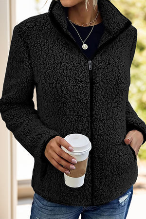 Black teddy fleece zip-up jacket with stand-up collar and pockets.