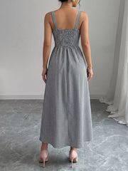 Black and white gingham midi dress with square neckline and smocked bodice, A-line skirt.
