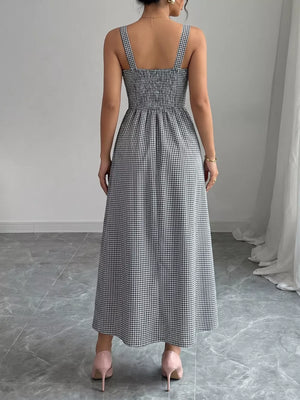 Black and white gingham midi dress with square neckline and smocked bodice, A-line skirt.