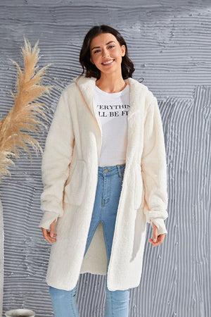 Cream plush hooded duster with thumbhole cuffs and pockets.