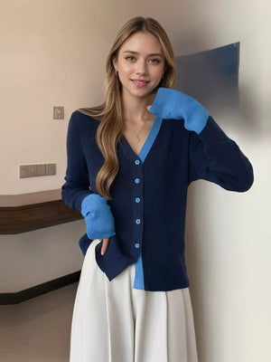 Navy ribbed cardigan with sky blue contrast trim and sleeves, buttoned front.