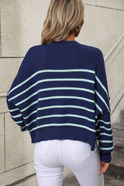 Navy and aqua striped boxy knit sweater with crew neck and relaxed fit.