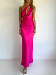 Rose red satin asymmetric halter maxi dress with a body skimming cut.