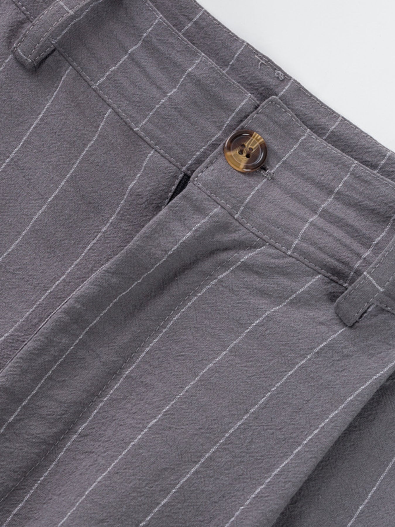 Grey striped men's sweatpants with a button closure and textured fabric.