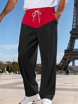 Two-tone black and red relaxed fit men's sweatpants with drawstring waist.