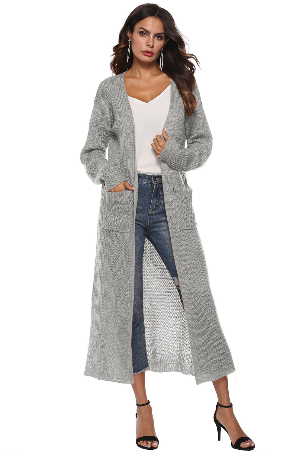 Longline knit cardigan in light gray with pockets and side slits.