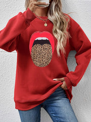 Red crewneck sweatshirt with a bold leopard print tongue graphic and red lips.