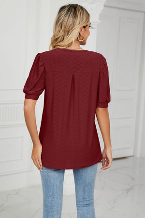Perforated puff sleeve blouse in wine with a keyhole detail.
