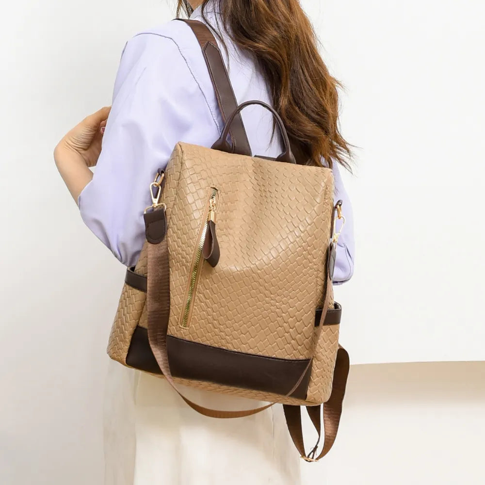 Tan woven faux leather convertible backpack with dark brown trim and gold zipper.