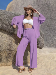 Lavender lace-embellished open front set with wide-leg pants and a white bralette.