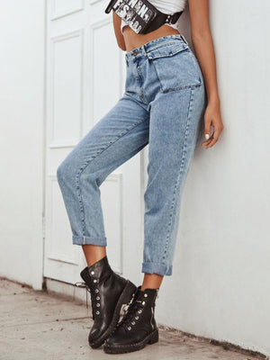 Light wash barrel leg jeans with unique pocket details and cuffed hems.