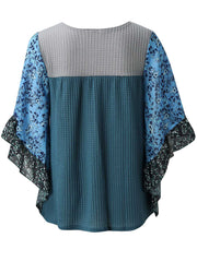 Textured panel blouse in Dusty Blue with floral flutter sleeves and waffle knit.