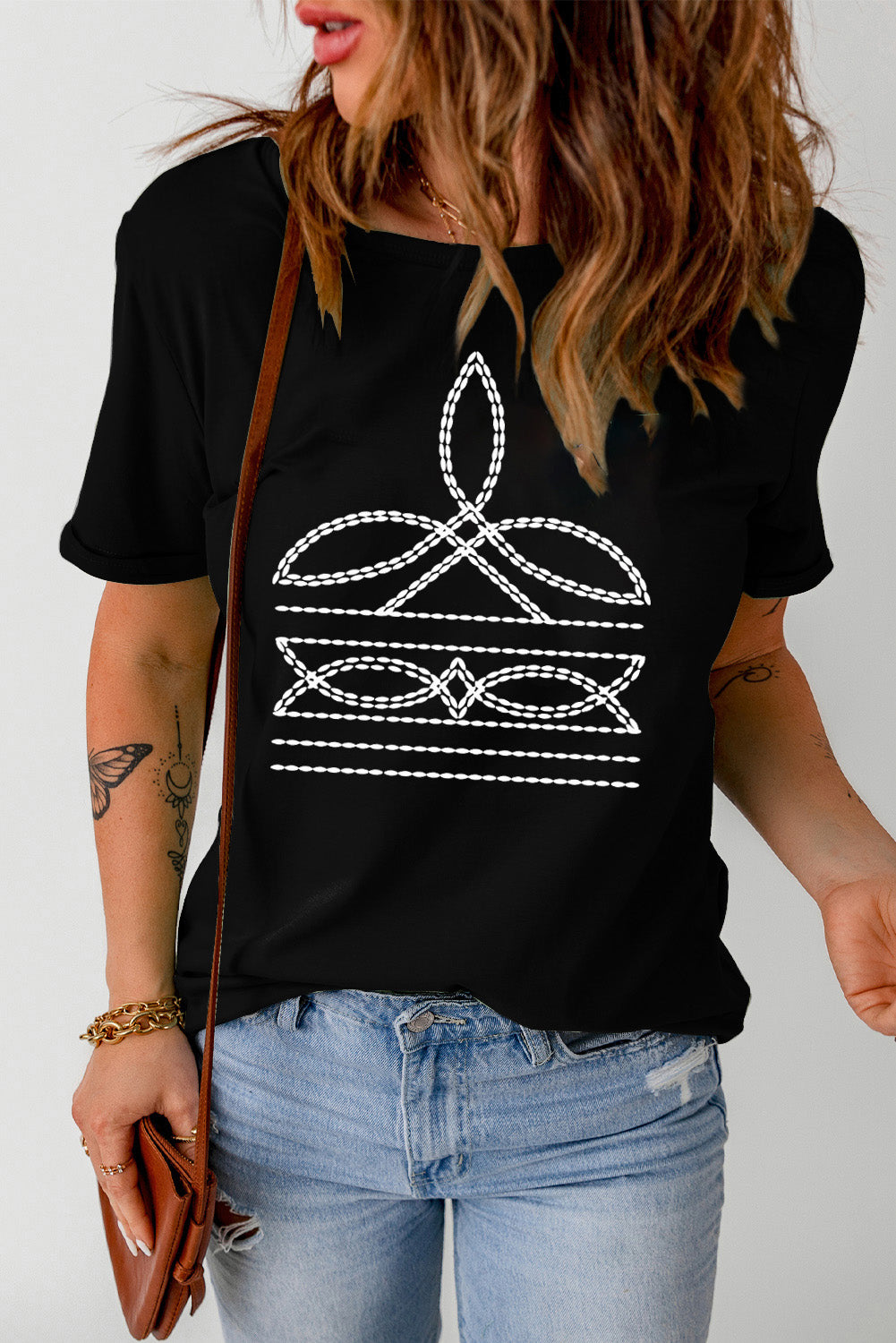Black crew neck t-shirt with white embroidered graphic detail on the chest.