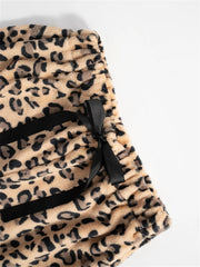 Leopard print lounge palazzo trousers with black bow detail and satin trim.
