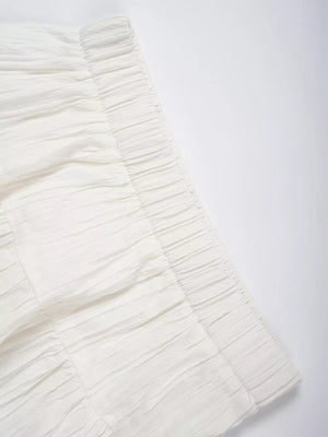 White tiered maxi skirt with elastic waistband and textured fabric detail