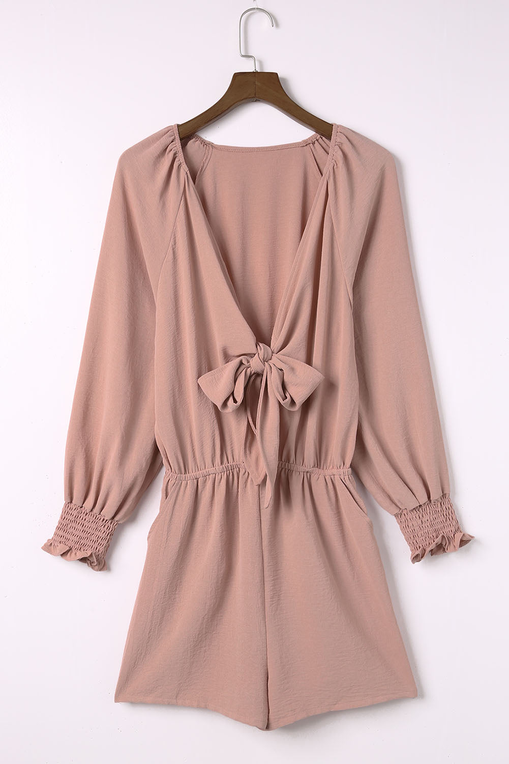 Dusty Pink tie-front blouson sleeve playsuit with smocked cuffs and cinched waist.