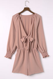 Dusty Pink tie-front blouson sleeve playsuit with smocked cuffs and cinched waist.