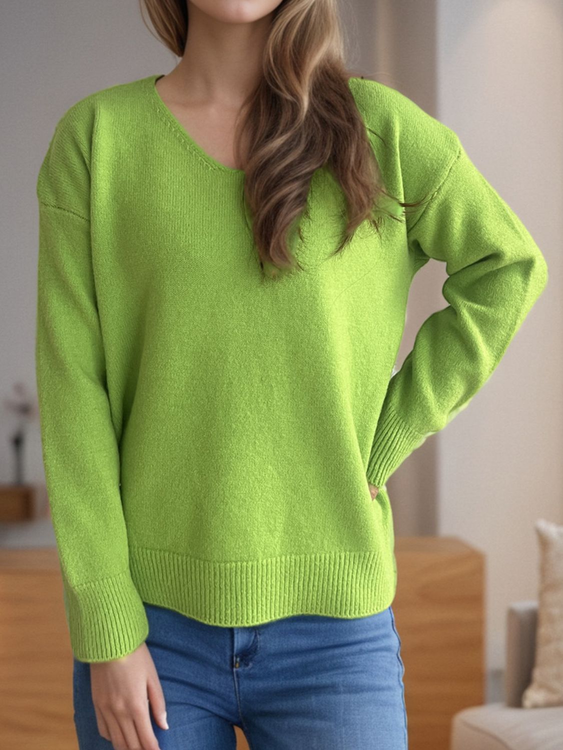 Lime green acrylic V-neck sweater with ribbed hem and cuffs.