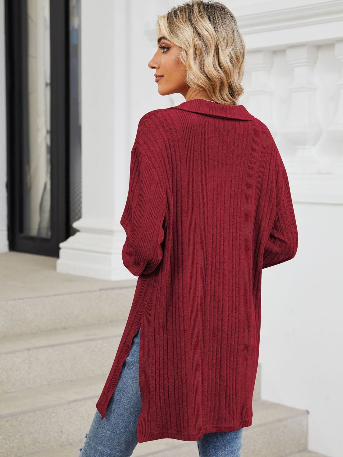 Burgundy ribbed knit collared tunic with slit hem and long sleeves.