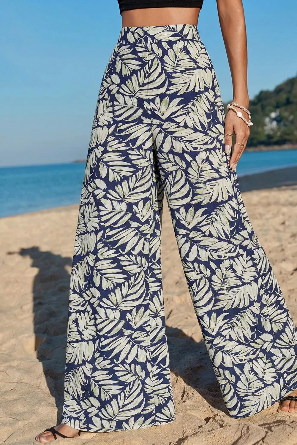 Navy leaf print maternity wide-leg trousers in cotton, high-waisted with a relaxed fit.