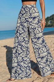 Navy leaf print maternity wide-leg trousers in cotton, high-waisted with a relaxed fit.