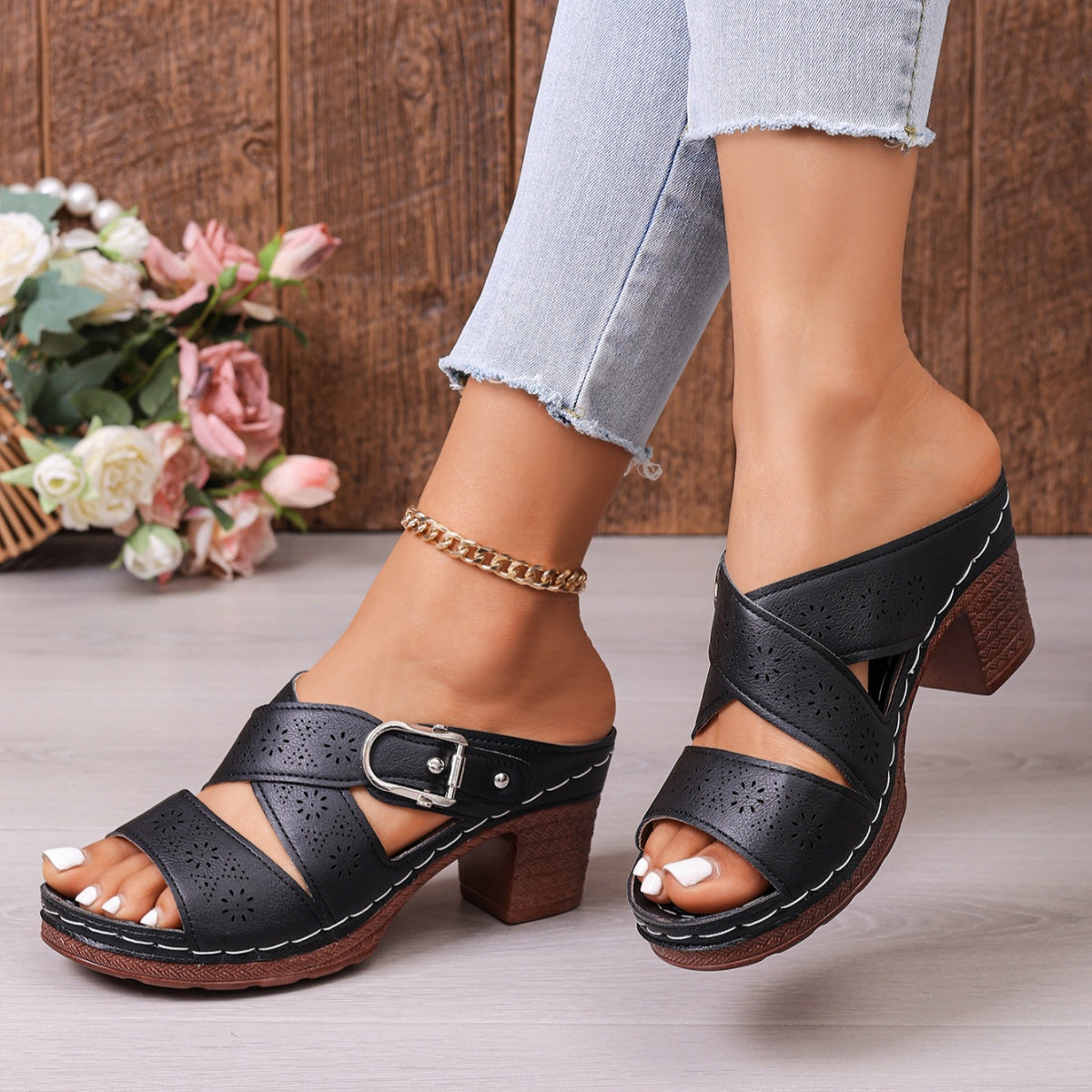 Black laser-cut criss-cross block heel sandals with buckle detail