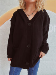 Black chunky knit hooded button-down cardigan with pockets and large buttons.
